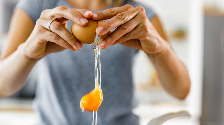 Why You Should Always Crack Eggs On Your Counter